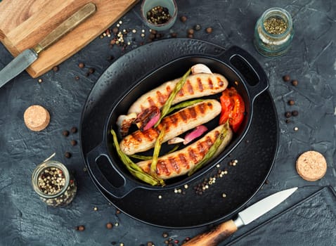 Juicy barbecue sausages BBQ. German grilled sausages. Bratwurst.