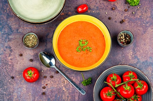 Dietary cream soup of fresh tomatoes. Vegetarian dish. Flat lay.