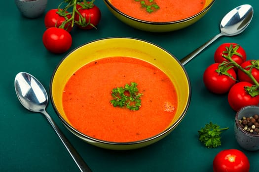 Dietary cream soup of fresh tomatoes. Vegetarian dish. Flat lay.