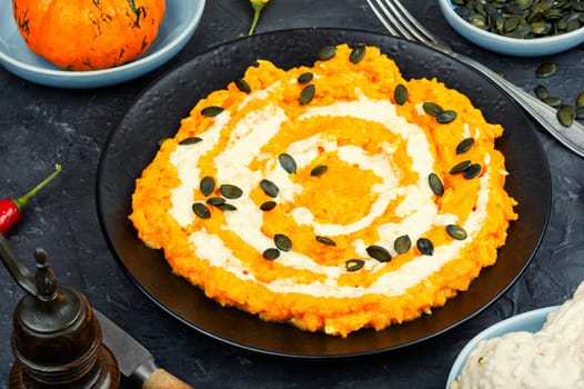 Delicious pumpkin risotto with parmesan cheese. Cooking risotto with pumpkin. Pumpkin food. Copy space.