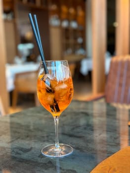 Aperol Spritz - A refreshing Italian cocktail combining Aperol, Prosecco, and a splash of soda, garnished with an orange slice, perfect for warm days and casual gatherings.