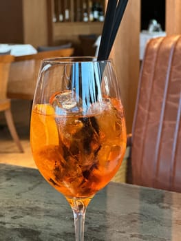 Aperol Spritz - A refreshing Italian cocktail combining Aperol, Prosecco, and a splash of soda, garnished with an orange slice, perfect for warm days and casual gatherings.