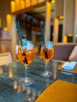 Aperol Spritz - A refreshing Italian cocktail combining Aperol, Prosecco, and a splash of soda, garnished with an orange slice, perfect for warm days and casual gatherings.