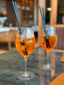 Aperol Spritz - A refreshing Italian cocktail combining Aperol, Prosecco, and a splash of soda, garnished with an orange slice, perfect for warm days and casual gatherings.