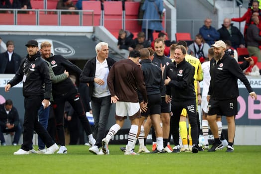 Celebrations for sporting director Andreas Bornemann (FC St. Pauli) and the entire staff of St. Pauli after the 3-0 victory in the game of the 1st FBL: 24-25: 1st FBL: 24-25: 5th Sptg. SC Freiburg - FC St. Pauli  DFL REGULATIONS PROHIBIT ANY USE OF PHOTOGRAPHS AS IMAGE SEQUENCES AND/OR QUASI-VIDEONann  Photo: Joachim Hahne/johapress