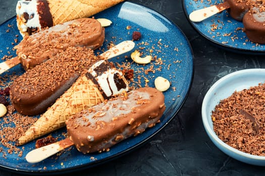 Ice cream with chocolate on a stick. Chocolate popsicles.