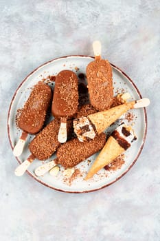 Ice cream with chocolate on a stick. Chocolate popsicles.