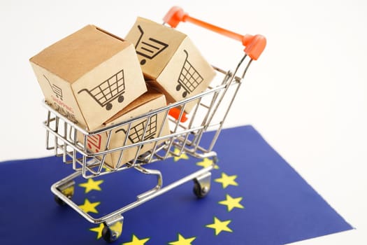Online shopping, Shopping cart box on EU flag, import export, finance commerce.