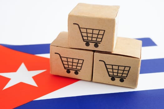 Online shopping, Shopping cart box on Cuba flag, import export, finance commerce.