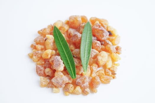 Frankincense or olibanum aromatic resin isolated on white background used in incense and perfumes.