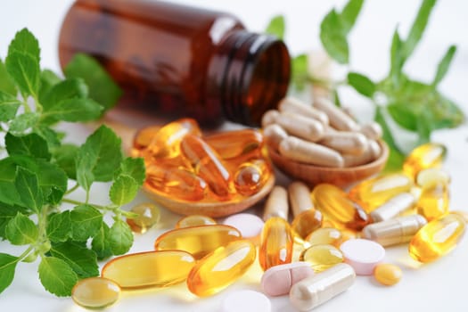 Alternative medicine herbal organic capsule with vitamin E omega 3 fish oil, mineral, drug with herbs leaf natural supplements for healthy good life.