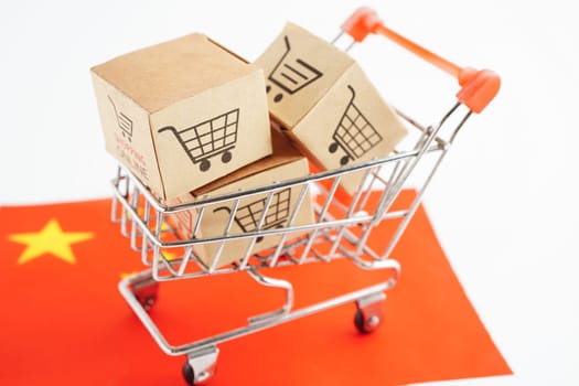 Online shopping, Shopping cart box on China flag, import export, finance commerce.