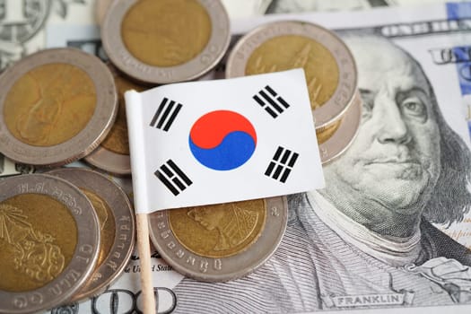 Korea flag on coin and banknote money, finance trading investment business currency concept.