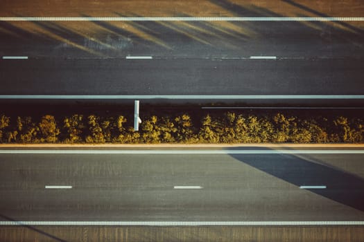 Directly above shot of two lane highway with no cars