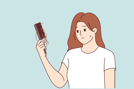 Hair loss upsets woman with comb in hand, suffering from lack of calcium in body or use of low-quality shampoo. Problem of hair loss causes stress and depression in girl who sees symptoms of baldness