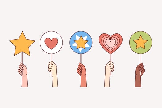 People hold up rating signs with hearts and stars, symbolizing support and approval for company or blogger. Rating marks of positive feedback from users and clients who have used services