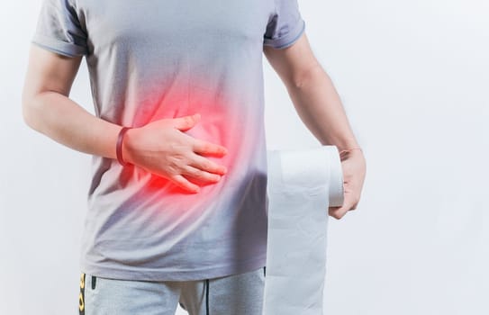 Person with diarhea holding toilet paper roll. Diarhea and stomach problems concept