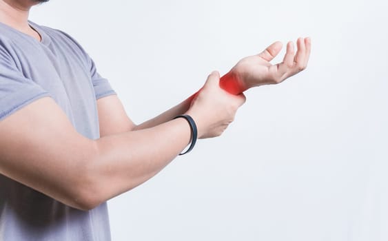 Person with arthritis holding and rubbing hand isolated. Hands of young man with arthritis and  rheumatism