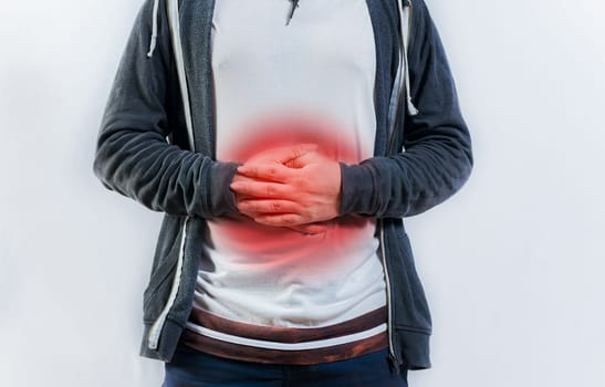 Person with digestive and stomach problems isolated. Unhappy man with digestive problems isolated