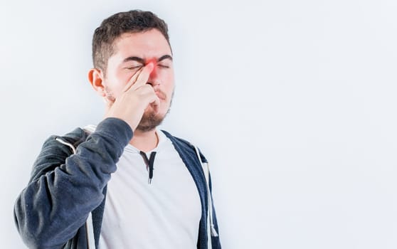 Person with sinusitis and nasal inflammation. Man with nasal congestion isolated