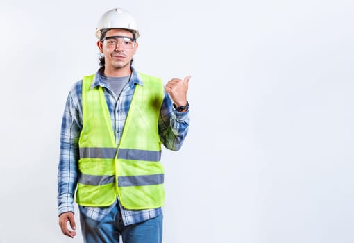 Male construction engineer pointing at an advertisement. Engineer man pointing side isolated. Male builder pointing finger to the right isolated