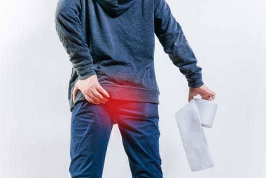 People with diarrhea problems, holding bathroom toilet paper isolated. Concept of person with diarhea holding toilet paper