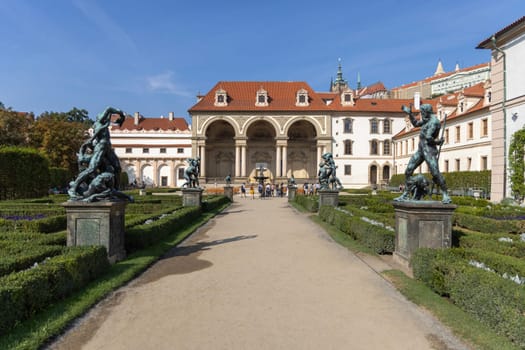 Prague, Czech Republic - September 3, 2024: Wallenstein Palace (Valdstejnska Zahrada) and Wallenstein Garden with  Fountain of Hercules (Herkulova fontana). Prague Castle on Hradcany in background