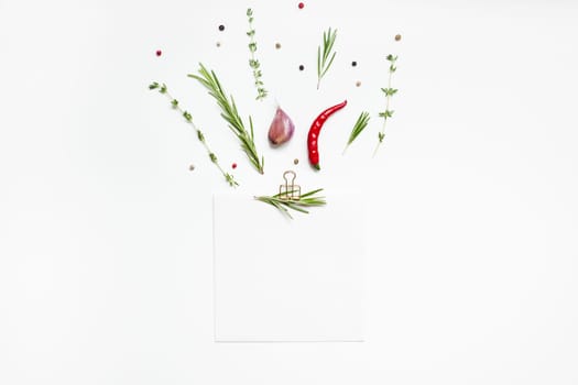 Flat lay overhead view blank notebook pages mockup text space invitation card on white background with greens herbs and spices. Menu or recipe book or food blog design with cooking ingredients