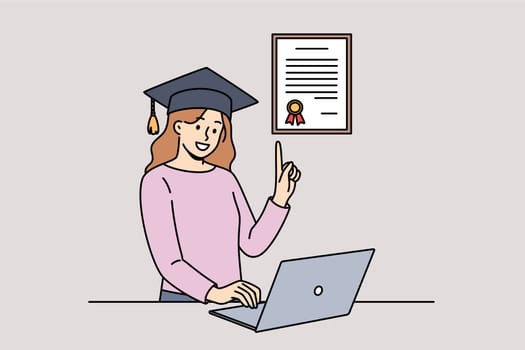 Woman graduate receives online education using laptop and demonstrates certificate of acquired knowledge. Girl with online education increased qualifications through webinars and video lessons