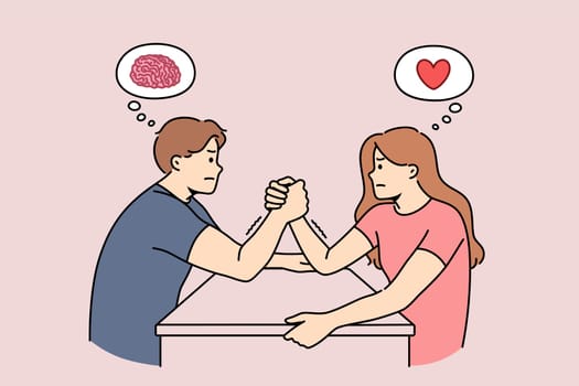 Gender conflict between man and woman engaged in arm wrestling, and thinking with heart or brain. Difference rational and emotional ways of thinking causes gender conflict in couple