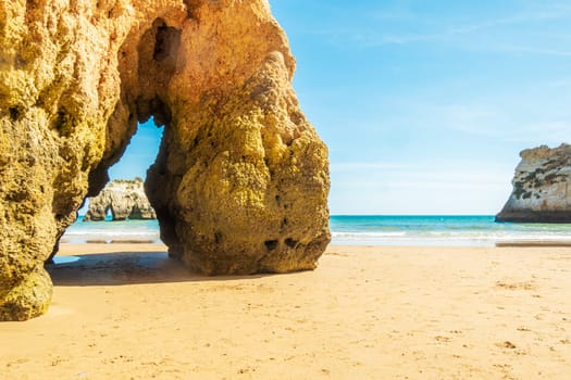 Beach and rugged coastline, photographed in the Algarve region of Portugal