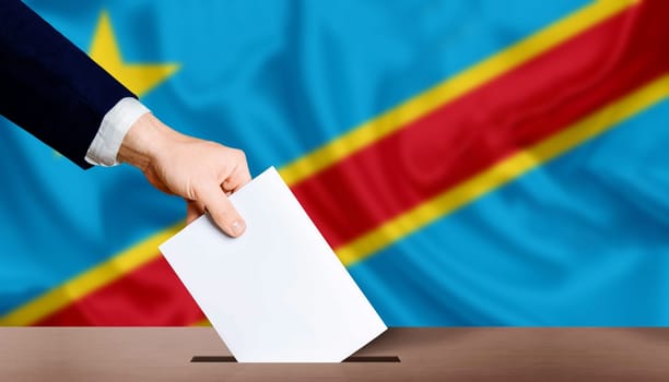 Hand holding ballot in voting ballot box with Democratic Republic of the Congo flag in background. Presidential elections of the democratic republic of the congo