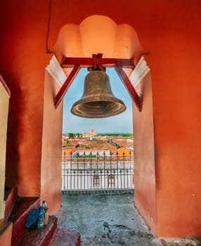 Bell tower of the La Merced church with a view of the cathedral in Granada, Nicaragua