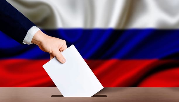 Hand holding ballot in the ballot box with Russia flag in the background. Presidential elections of the Russian Federation