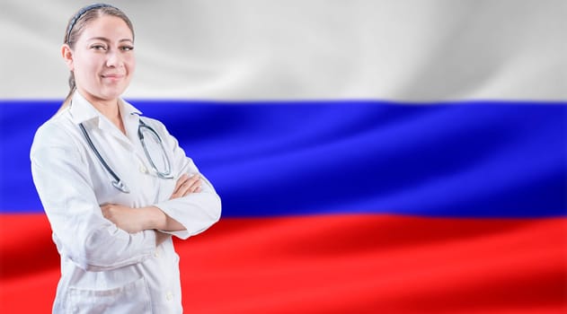 Doctor with crossed arms on flag of Russian Federation. Doctor with stethoscope on Russian flag. Russian health and care concept