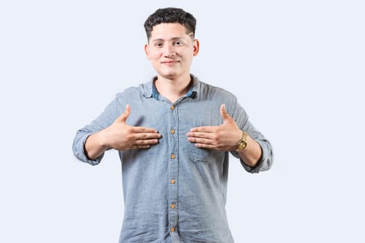 Interpreter person gesturing HAPPINESS in sign language. Smiling young man gesturing HAPPINESS in sign language