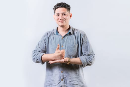 Person gesturing HELP with hands in sign language. Smiling interpreter gesturing HELP with hands in sign language isolated
