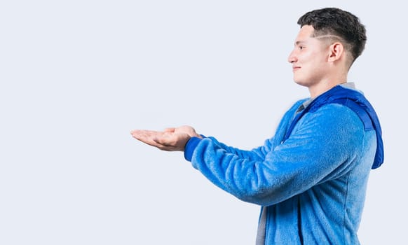 Smiling person showing something with palms together. Guy showing something with palms together isolated