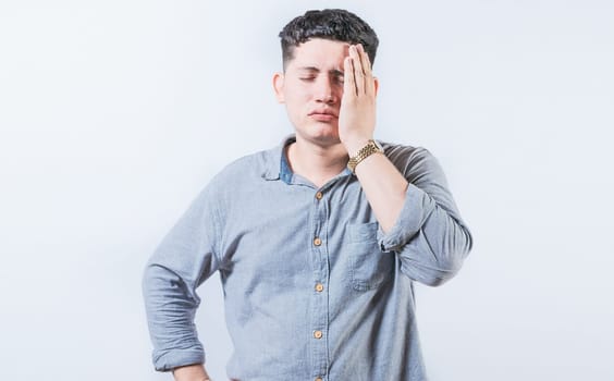 Exhausted person putting the palm of his hand on his face. Tired and exhausted man covering his face with the palm hand