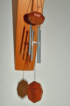 wind chime in a room with shadows