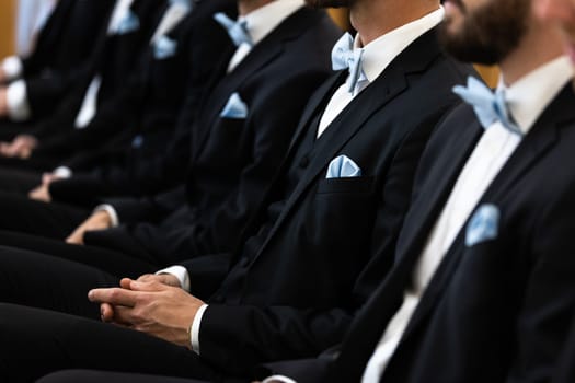 Guests sit on benches during a wedding in the Catholic Church.