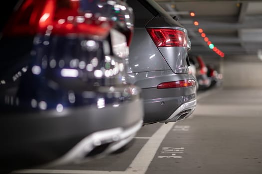 Underground garage or modern car parking with lots of vehicles, perspective