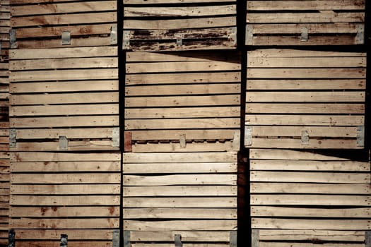 Grunge Crates stack. weathered wooden boxes in tall rows