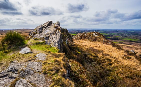 Magnificent panorama from the highest point in Brittany over the moors and hills. Roch Trevezel, Monts d'Arrée, France