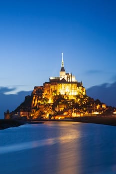 Mont Saint-Michel vertical photo taken at blue hour, Normandy, France