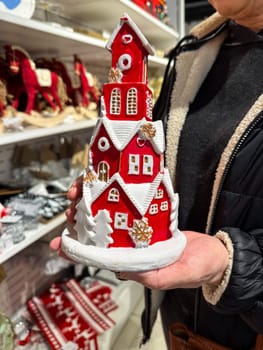 Close-up festive red Christmas house decoration. Holiday season decor and bringing a touch of cheer to home.