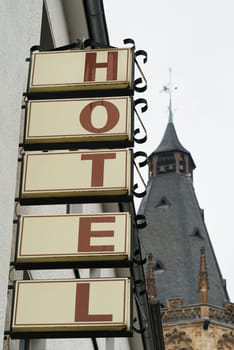 neon sign on the wall of a hotel in the city center of Cologne