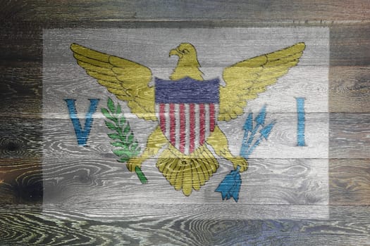 A US Virgin Islands flag on rustic old wood surface background