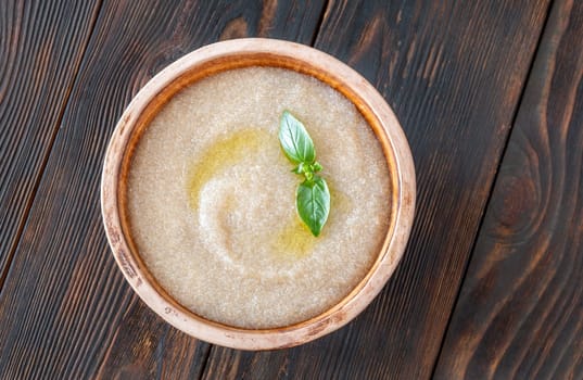 Bowl of Amaranth Porridge on wooden background