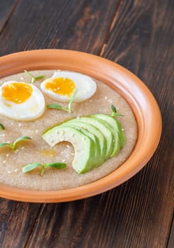Amaranth Porridge bowl with eggs and avocado